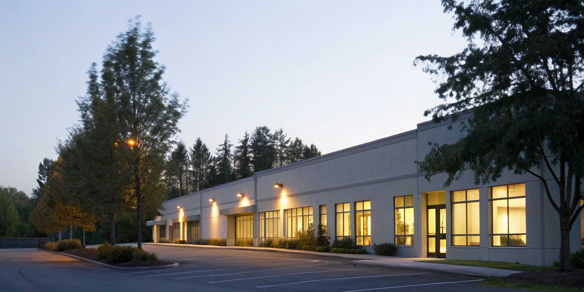 Commercial building remains powered on at dusk, ensuring business continuity with backup power.